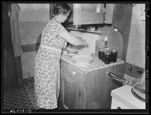 Untitled photo, possibly related to: Lancaster County, Pennsylvania. Mr. [i.e. Mrs.] Royer peeling potatos on the Enos Royer farm