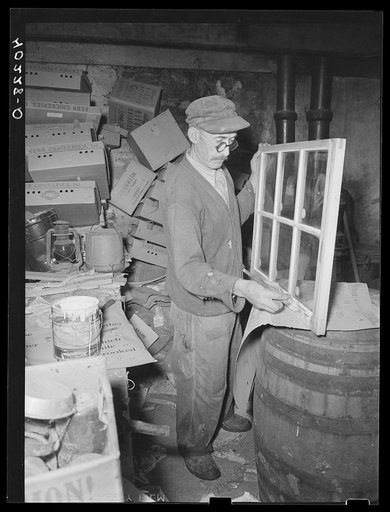 Lancaster County, Pennsylvania. One of the hired men on the Enos Royer farm painting a window sash for the chicken house. It is cheaper to buy sashes unpainted than it is to make them