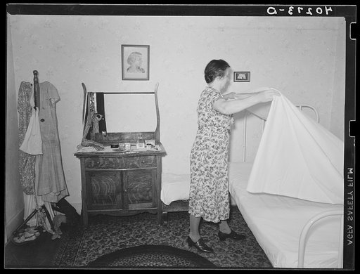 Lancaster County, Pennsylvania. Mrs. Royer making Martha Royer's bed on the Enos Royer farm
