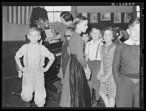 Untitled photo, possibly related to: Lancaster County, Pennsylvania. The children in Martha Royer's school singing the "Star Spangled Banner." Notice the Amish boy on the extreme left