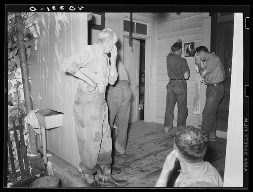 Lancaster County, Pennsylvania. Men who have come to help Royer fill his silo washing up on the back porch of the Enos Royer farm before dinner