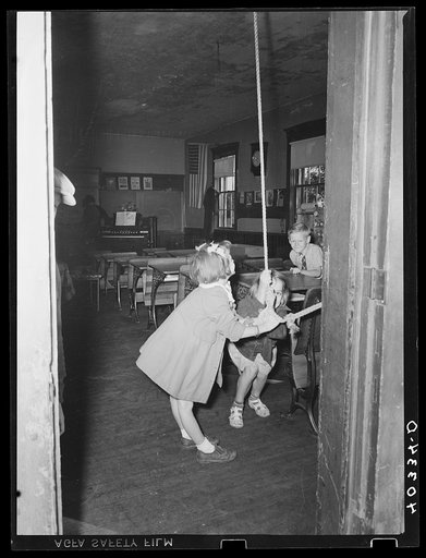 Lancaster County, Pennsylvania. Children ringing the school bell at the schoolhouse in which Martha Royer teaches