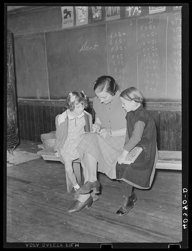 Lancaster County, Pennsylvania. Martha Royer teaching two first graders in a one-room school