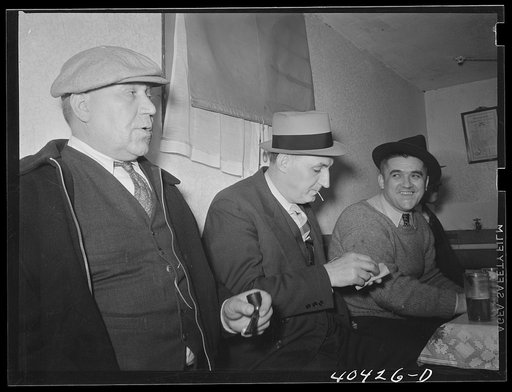 Shenandoah, Pennsylvania. Three miners at a beer party in Joe Gladski's cellar