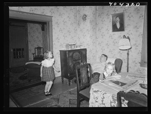 Shenandoah, Pennsylvania. Joe Gladski and two small daughters in the dining room at their home. He is a miner at Maple Hill