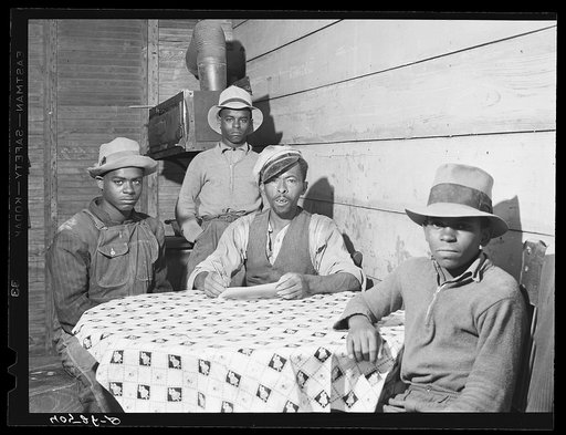FSA (Farm Security Administration) client Roger Spence and two of his sons. Two miles out of Princess Anne, Maryland