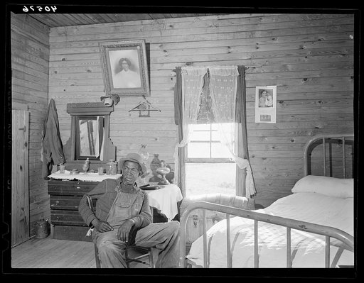The father of Mr. Hubbard, a Negro tenant farmer planting tobacco. The elder Mr. Hubbard is too old to work. Near Farrington, North Carolina