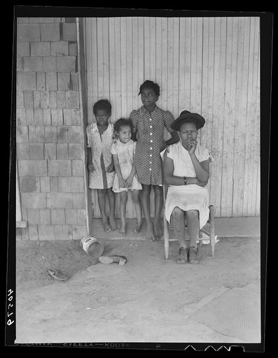 Some of the people living in an old garage converted into a dwelling. Outskirts of Graham, Alamance County, North Carolina