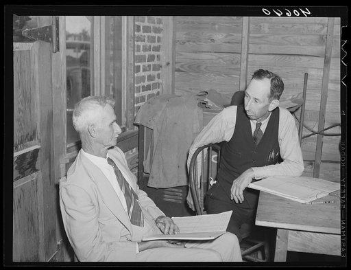 Two election officials at polling place on election day. Stem, Granville County, North Carolina