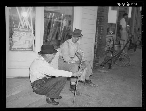 Men discussing the election on steps of general store in Stem, Granville County, North Carolina