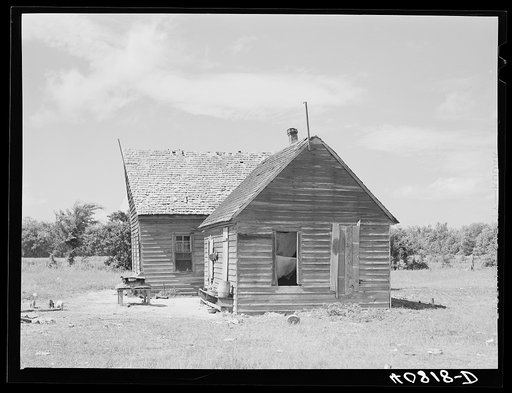 Thirty-five migrants use this farmhouse as their home. Near Old Trap, North Carolina