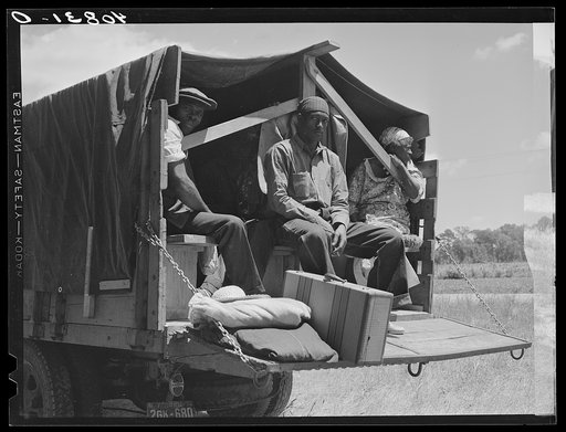 Untitled photo, possibly related to: Florida migratory agricultural workers leaving Old Trap, North Carolina, for New Jersey. The truck holds thirty-seven persons