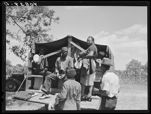 Florida migratory agricultural workers leaving Old Trap, North Carolina, for New Jersey. The truck holds thirty-seven persons
