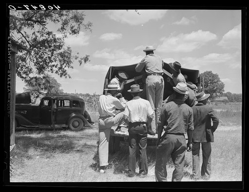 Untitled photo, possibly related to: Florida migratory agricultural workers leaving Old Trap, North Carolina, for New Jersey. The truck holds thirty-seven persons