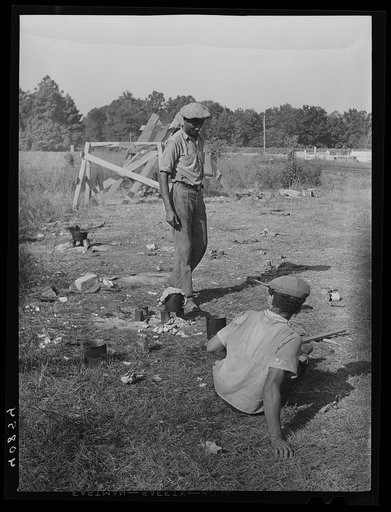 Migrants cooking lunch at the grading station at Camden, North Carolina