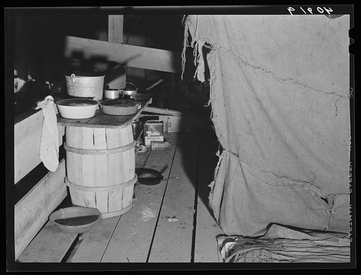 Cooking facilities for migratory agricultural workers living in the attic of a potato grading station at Belcross, North Carolina