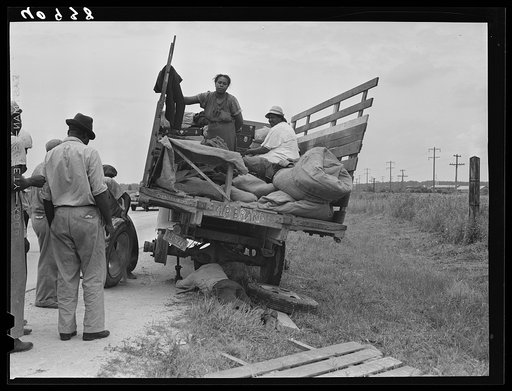 This truck carrying about thirty-seven North Carolina migrants to pick beans near Easton, Maryland broke down on the road near Princess Anne, Maryland