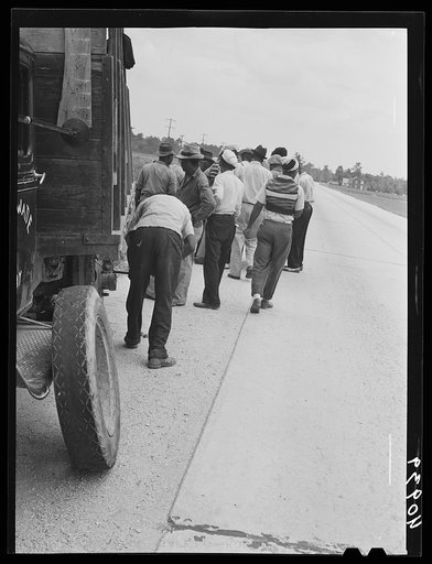 This truck carrying about thirty-seven North Carolina migrants to pick beans near Easton, Maryland broke down on the road near Princess Anne, Maryland
