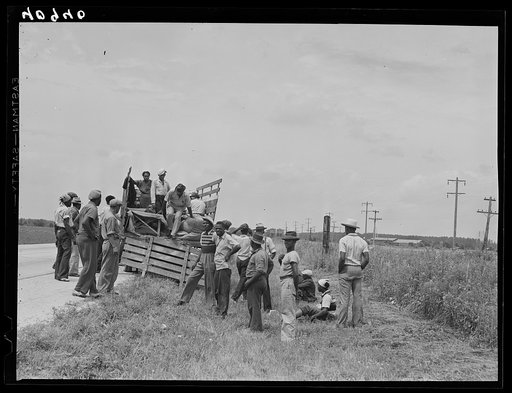 This truck carrying about thirty-seven North Carolina migrants to pick beans near Easton, Maryland broke down on the road near Princess Anne, Maryland