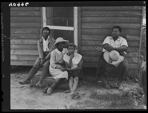 A group of Maryland tomato pickers resting during lunch period. Westover, Maryland