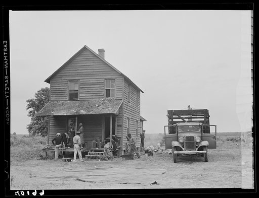 Florida migrant making preparations to leave a house at Belcross, North Carolina, for another job at Onley, Virginia
