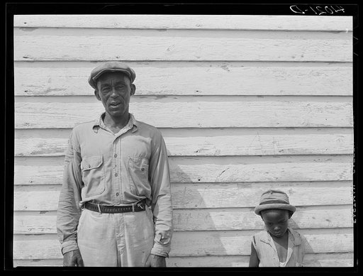 John Barnes, FSA (Farm Security Administration) client, and one of his children. Ridge, Maryland