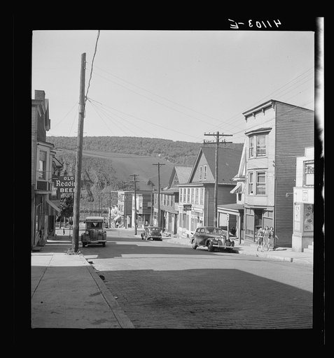 Untitled photo, possibly related to: Street in the important anthracite town of Coaldale, Pennsylvania, showing huge coal bank in background