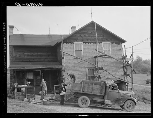 Loading produce to be taken to Tri-County Farmers Co-op Market in Du Bois, Pennsylvania, at the Knees farm near Penfield, Pennsylvania