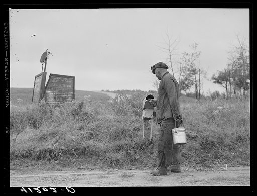 Mr. Ralph Reitz, miner and farmer, member of Tri-County Farmers Co-op Market at Du Bois, Pennsylvania, stops at mail-box on way home from mine, at his farm near Falls Creek, Pennsylvania
