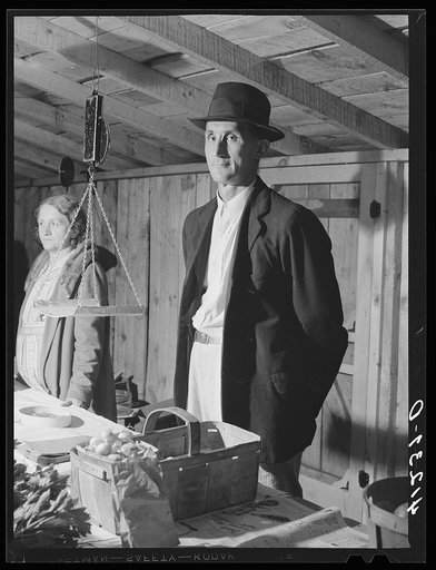 Untitled photo, possibly related to: Farmer and his wife at their booth in the Tri-County Farmers Co-op Market at Du Bois, Pennsylvania