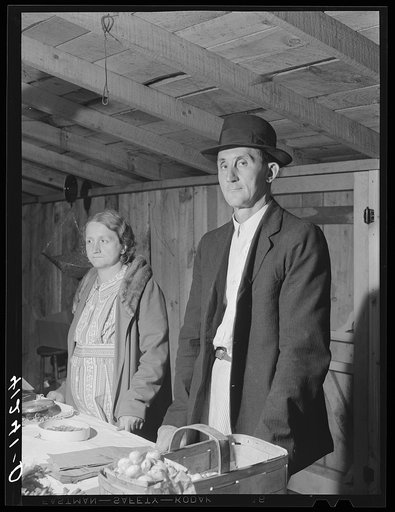 Farmer and his wife at their booth in the Tri-County Farmers Co-op Market at Du Bois, Pennsylvania