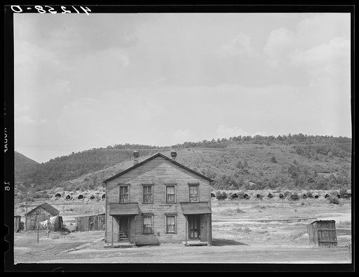 House in near-deserted town of Tyler, Pennsylvania, showing abandoned coke ovens in background
