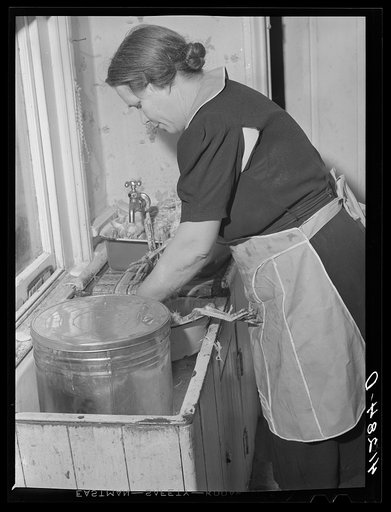 Mr. Ralph Reitz, member of the Tri-County Co-op Market at Du Bois, Pennsylvania, preparing baked goods for market at her farm near Falls Creek, Pennsylvania