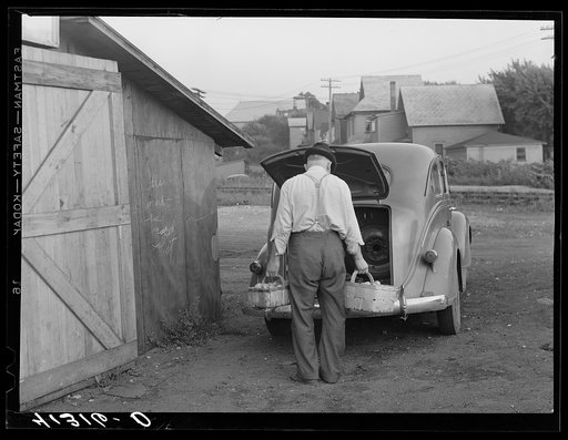 Mr. Ralph Reitz unloading produce outside of Tri-County Farmers Market in Du Bois, Pennsylvania. Produce to be sold at market