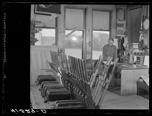 Mr. T.J. Long, president of the Tri-County Farmers Co-op Market in Du Bois, Pennsylvania, at his work in a railroad tower near Du Bois, Pennsylvania