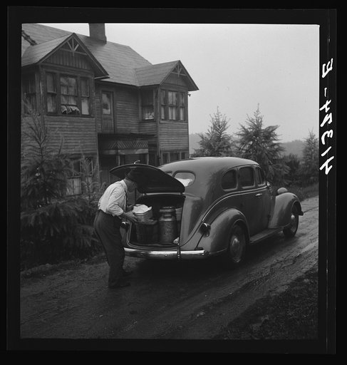 Untitled photo, possibly related to: Mr. Ralph Reitz loading produce at his farm near Falls Creek, Pennsylvania for sale at the Tri-County Farmers Co-op Market in Du Bois, Pennsylvania, of which he is a member