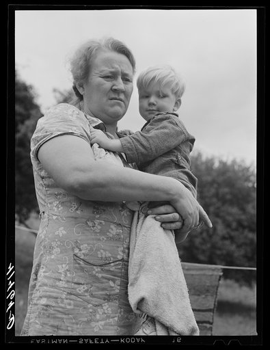Untitled photo, possibly related to: Farm woman holding one of her children in submarginal farm area of Rumsey Hill, near Erin, New York