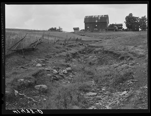 A dried up creek and old farmhouse near Townsend, New York
