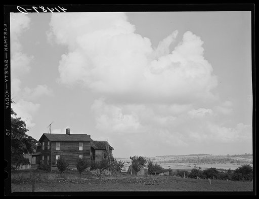 Farmhouse and windmill in Sugar Hill country, submarginal area near Townsend, New York