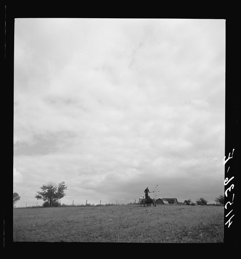 Untitled photo, possibly related to: Farmer spreading manure near Odessa, New York