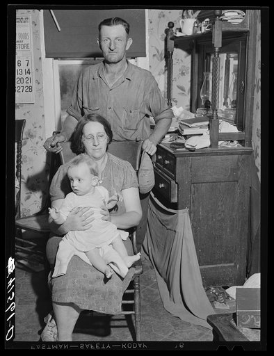 Mr. and Mrs. Colson and one of their children. Tobacco farmers, Suffield, Connecticut