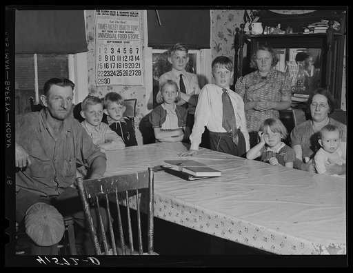 The Colson family, the children just back from school. Tobacco farmers near Suffield, Connecticut