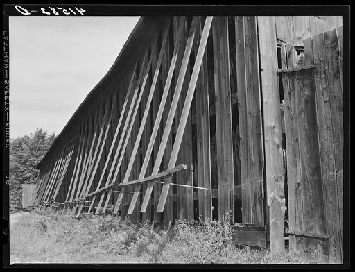 Untitled photo, possibly related to: "Doors" on tobacco barn open for ventilation near Suffield, Connecticut