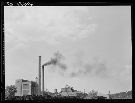 The Naugatuck Chemical Company with piles of old rubber tires. Naugatuck, Connecticut