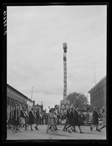 Untitled photo, possibly related to: The "Pototem pole" standing in the main street of Presque Isle as an advertising stunt for the barrel rolling contest in Presque Isle, Maine