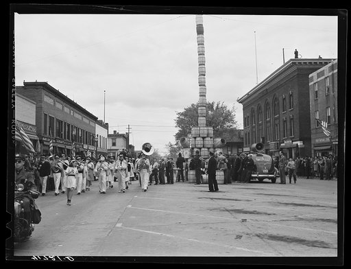 Untitled photo, possibly related to: The school band parading on the main street of Presque Isle, Maine, in celebration of the barrel rolling contest