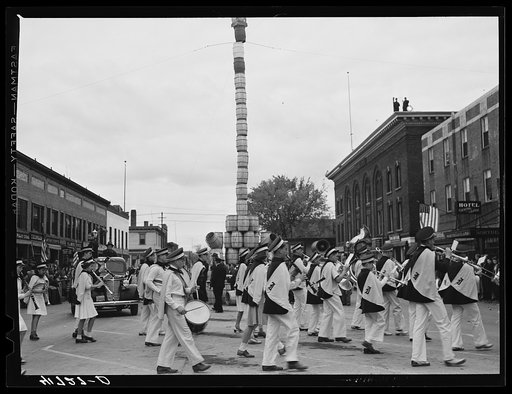 The school band parading on the main street of Presque Isle, Maine, in celebration of the barrel rolling contest