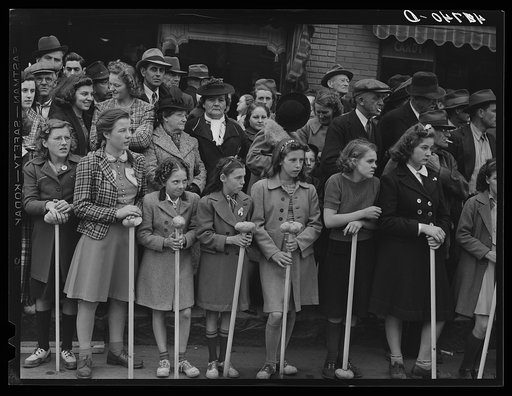 Schoolgirls and spectators at the barrel rolling contest in Presque Isle, Maine