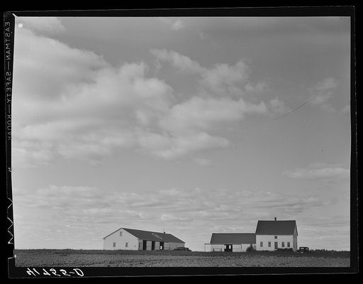Tractor garage and house occupied by the cook on one of the farms of the Woodman Potato Company eleven miles north of Caribou, Maine