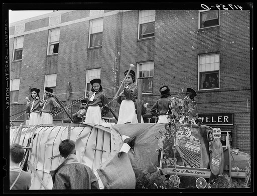 These drum majorettes were revealed when the giant wood and paper potato was open on the day of the barrel rolling contest in Presque Isle, Maine